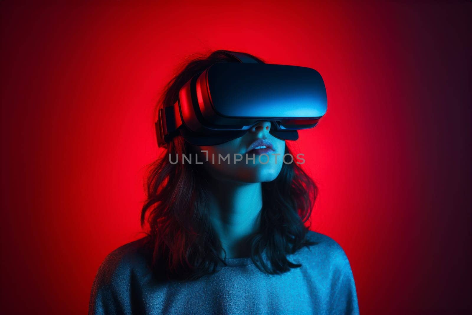 Young woman enjoying virtual reality experience in modern VR headset. Studying with new tech, simulation sciences. Student wears a virtual reality headset to study science home online. Futuristic lifestyle. VR, Virtual Reality, VR Goggles. Latest technology, games, augmented reality, AI, science. Modern ways of learning and studing