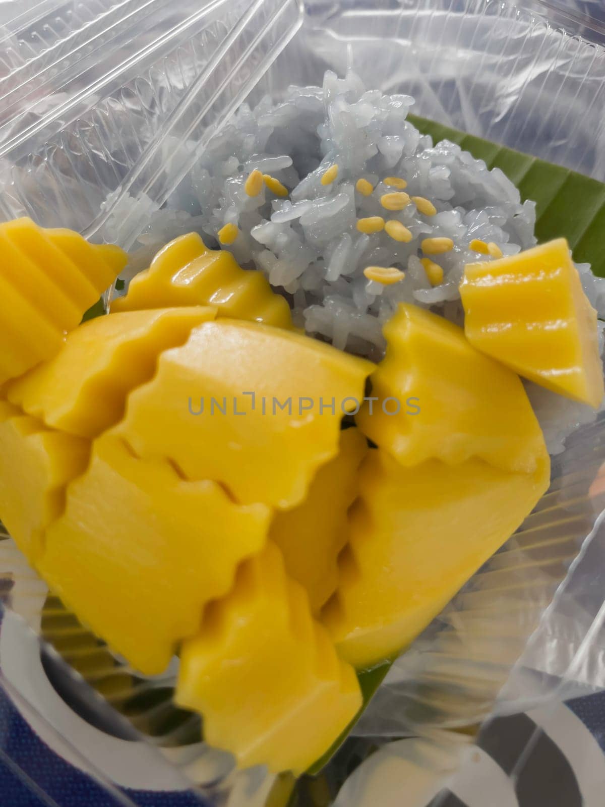 Mango with sticky rice traditional Thai dessert from market, stock photo