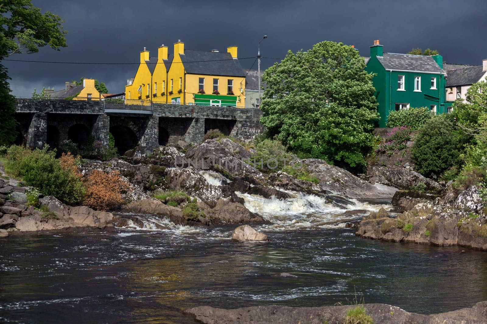 The village of Sneem on the Iveragh Peninsula in County Kerry in the Republic of Ireland. The River Sneem flows through the village.