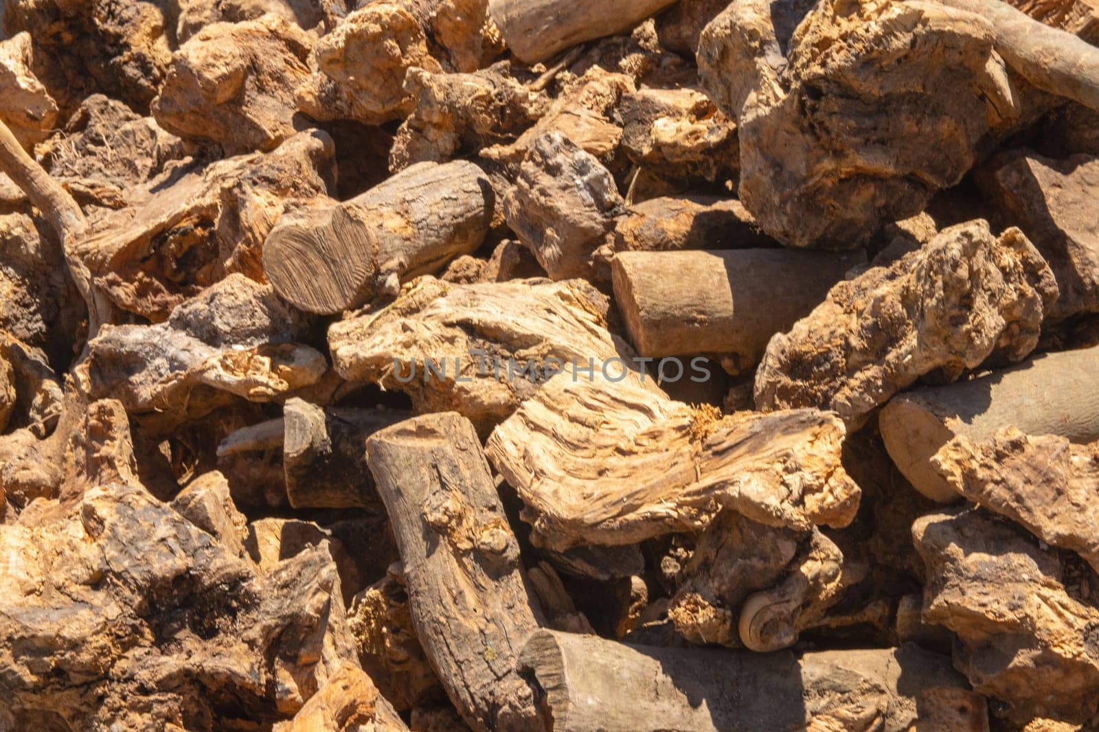 Wooden texture background. Wood for smoking and grilling meat and fish isolated on a white background. Pile of pieces of wood is used on the Costa del Sol in Andalusia.