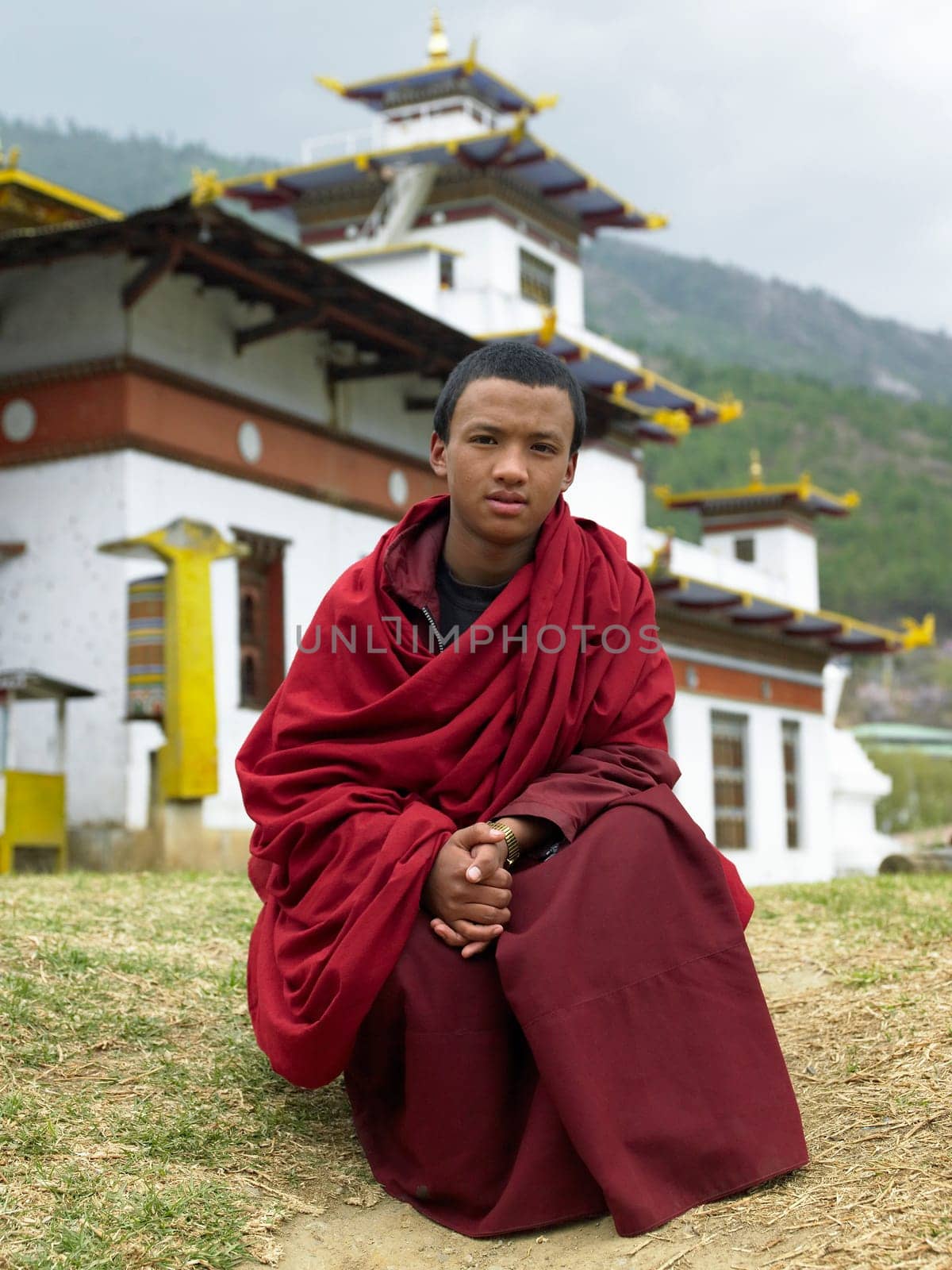 A young Bhutanese monk at Thimphu Dzong in the Kingdom of Bhutan.