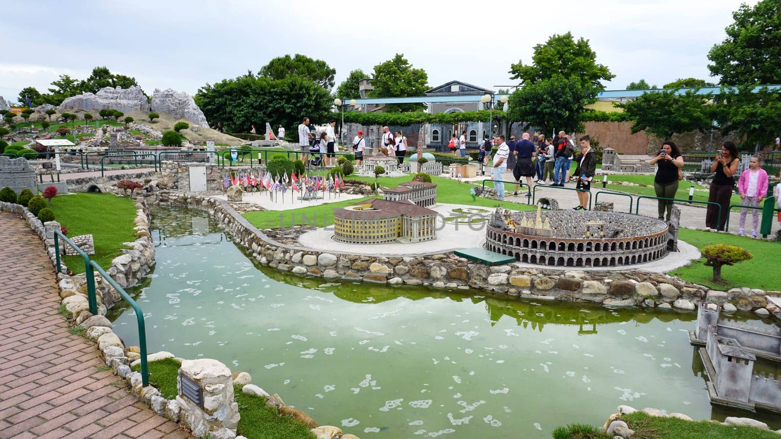 Viserba, Italy - June 25, 2024: People going at Theme park Italy in Miniature or Italia in Miniatura in Rimini, Italy - Reproduction of famous attractions in a small scale. Verona