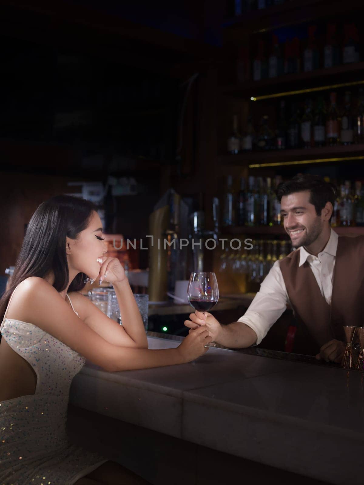 Woman is holding a glass of red wine. Bar, Restaurant, hospitality and beverage, Night club concept.