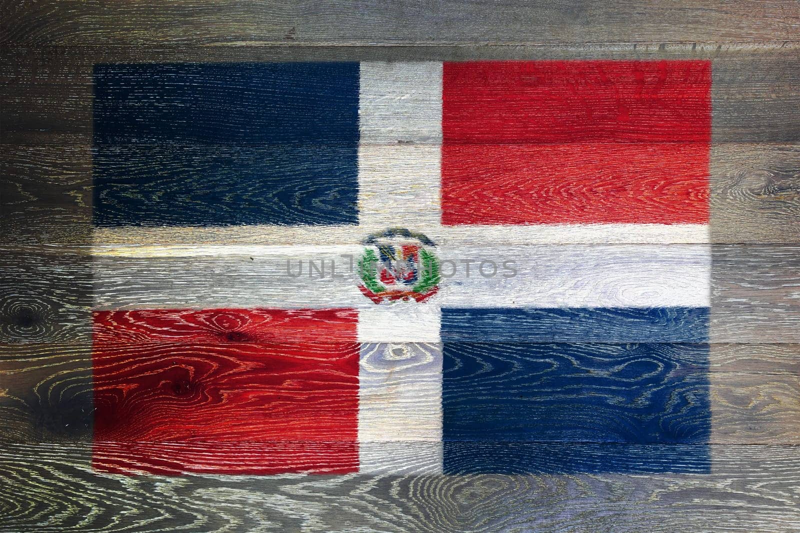 A Dominican republic flag on rustic old wood surface background red white blue