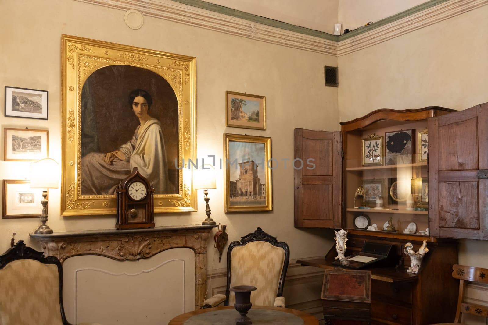 Masino, Italy - 12 December 2023: old apartment interior, early 20th century furniture, living room, nobody