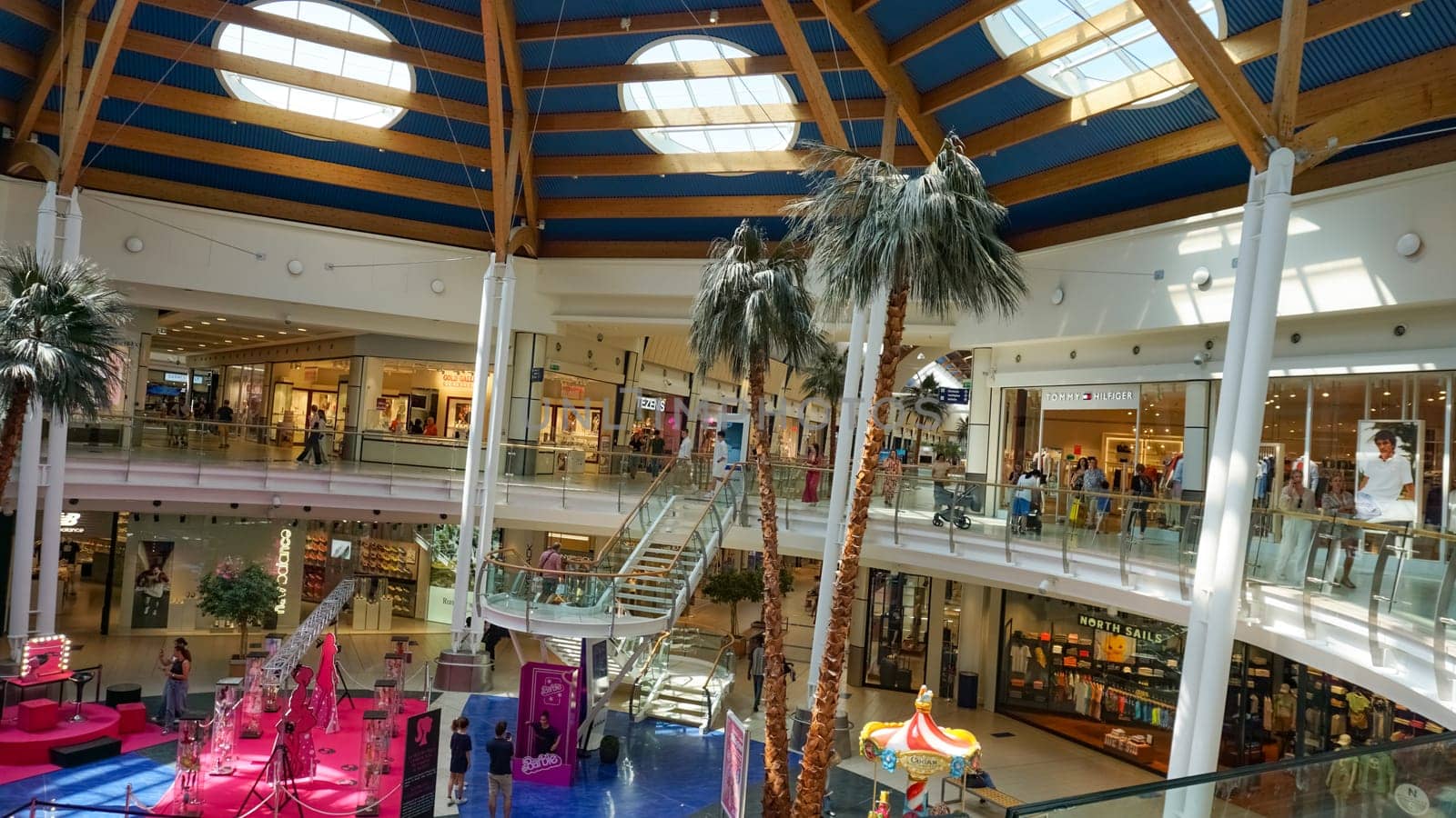Rimini, Italy - June 25, 2024: Le Befane Centre of Commerce. This is the biggest shopping center in Rimini. Unidentified people are shopping.