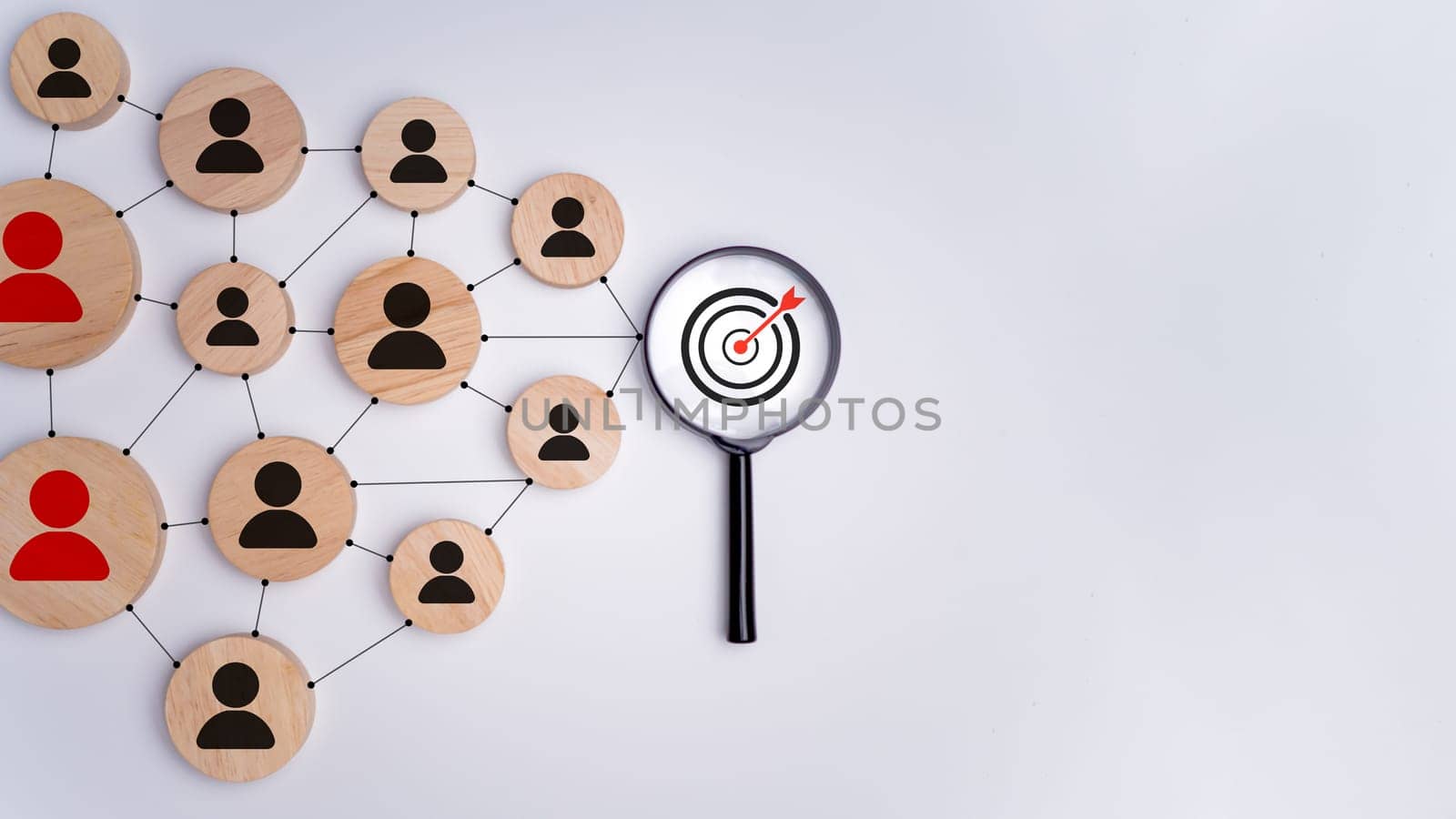 Wooden block with target icon linked with human icons for customer focus group, Customer relationship management concept, CRM, Customer relationship management and targeted marketing strategies.
