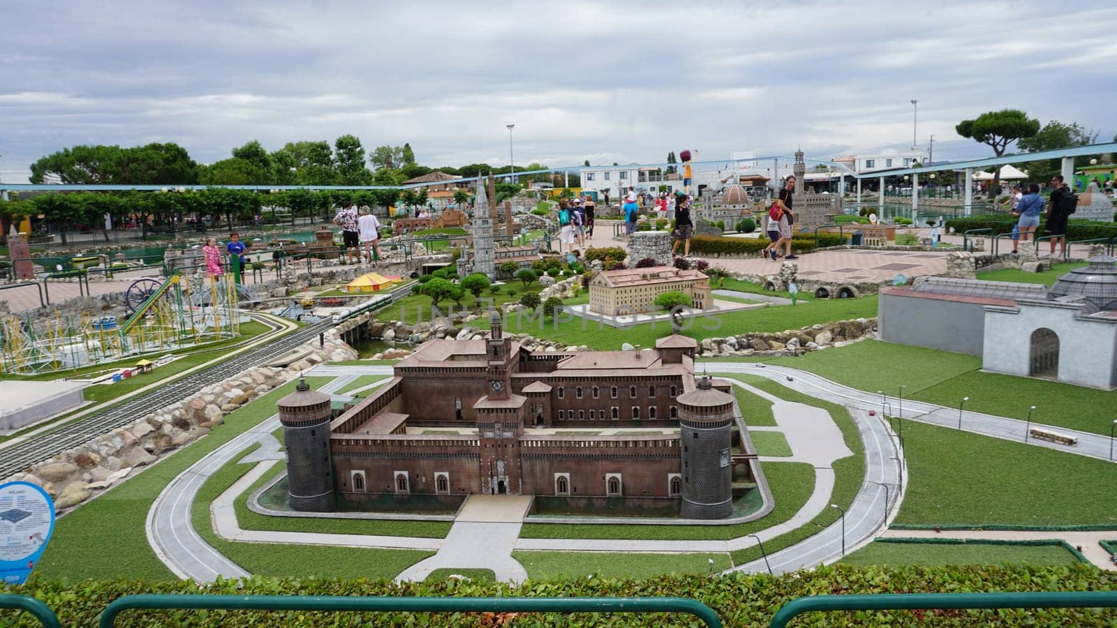 Viserba, Italy - June 25, 2024: People going at Theme park Italy in Miniature or Italia in Miniatura in Rimini, Italy - Reproduction of famous attractions in a small scale - Milan