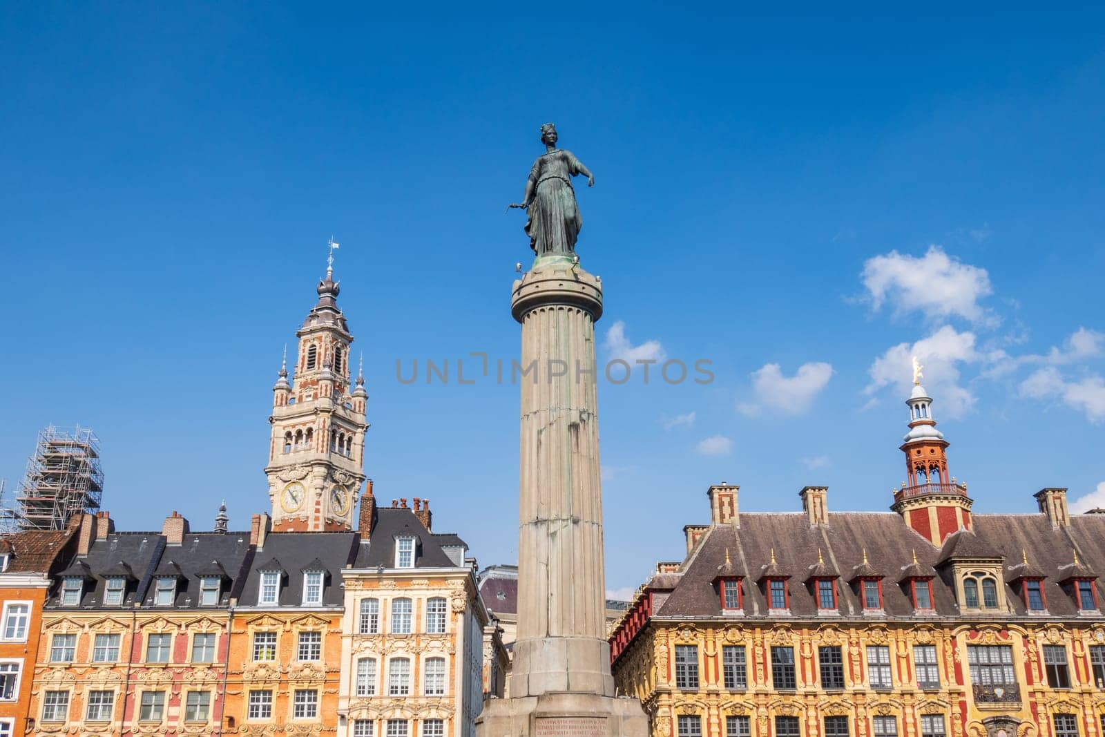 Grand Place in the city of Lille and its belfry over blue sky