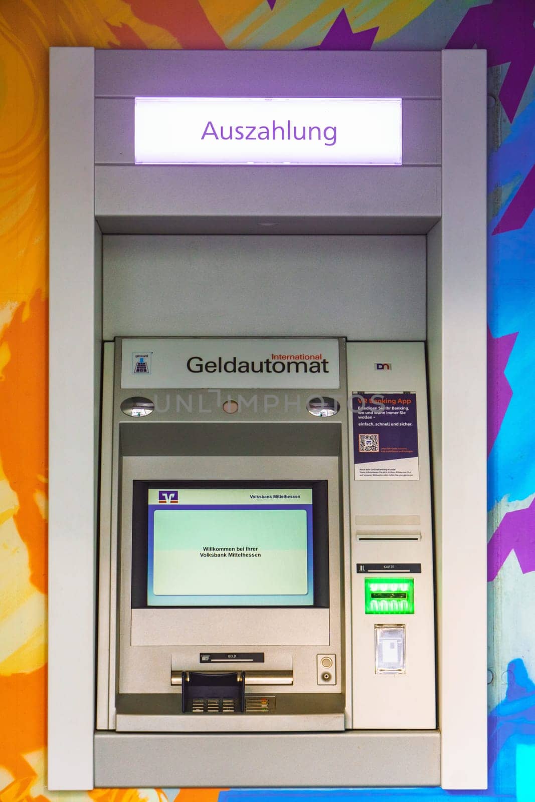 WETZLAR, HESSEN, GERMANY - 03-01-2024: public ATM to withdraw money of VOLKSBANK MITTELHESSEN. Volksbank Mittelhessen eG is a German cooperative bank.