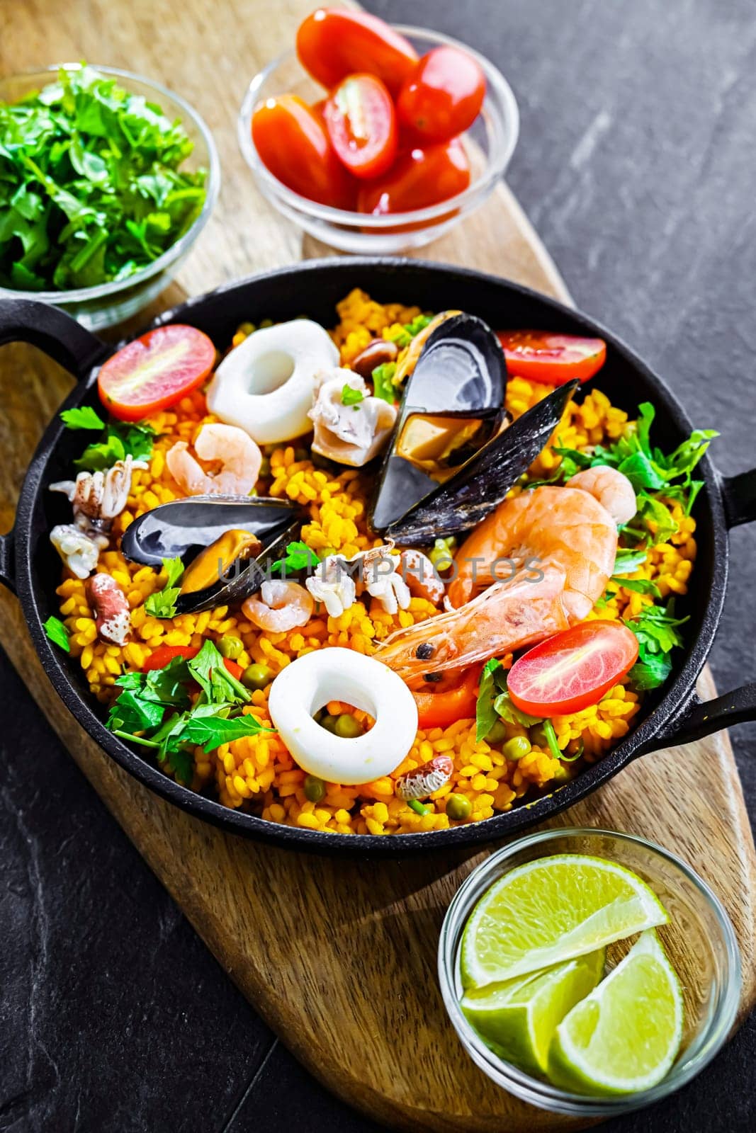 Seafood paella served in a cast iron pan.