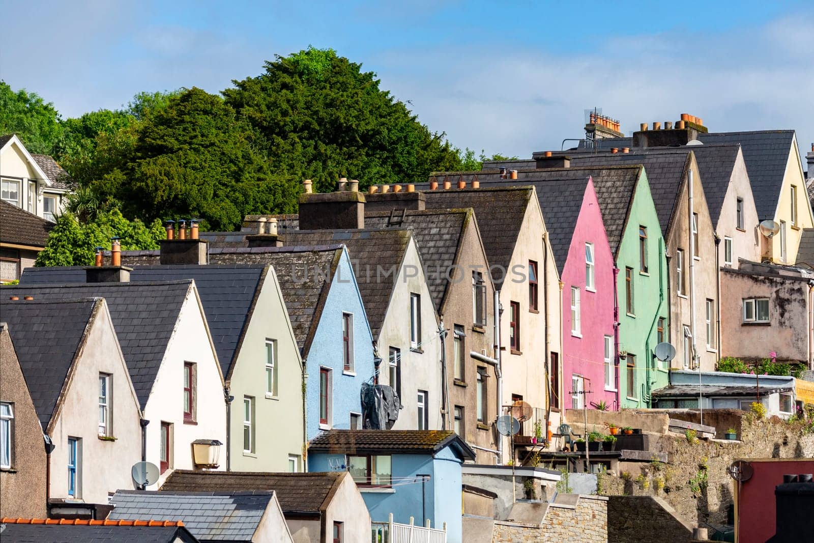 Colorful row of houses in the town and seaport of Cobh (known from 1849 to 1920 as Queenstown) in County Cork, Republic of Ireland.
