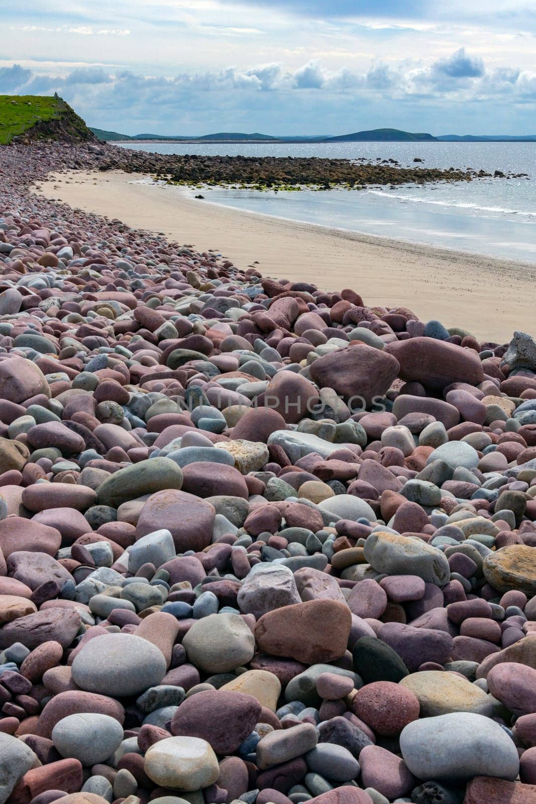 Pebbles on a beach near seaside village of Mulranny on the isthmus between Clew Bay and Blacksod Bay in County Mayo, Republic of Ireland.