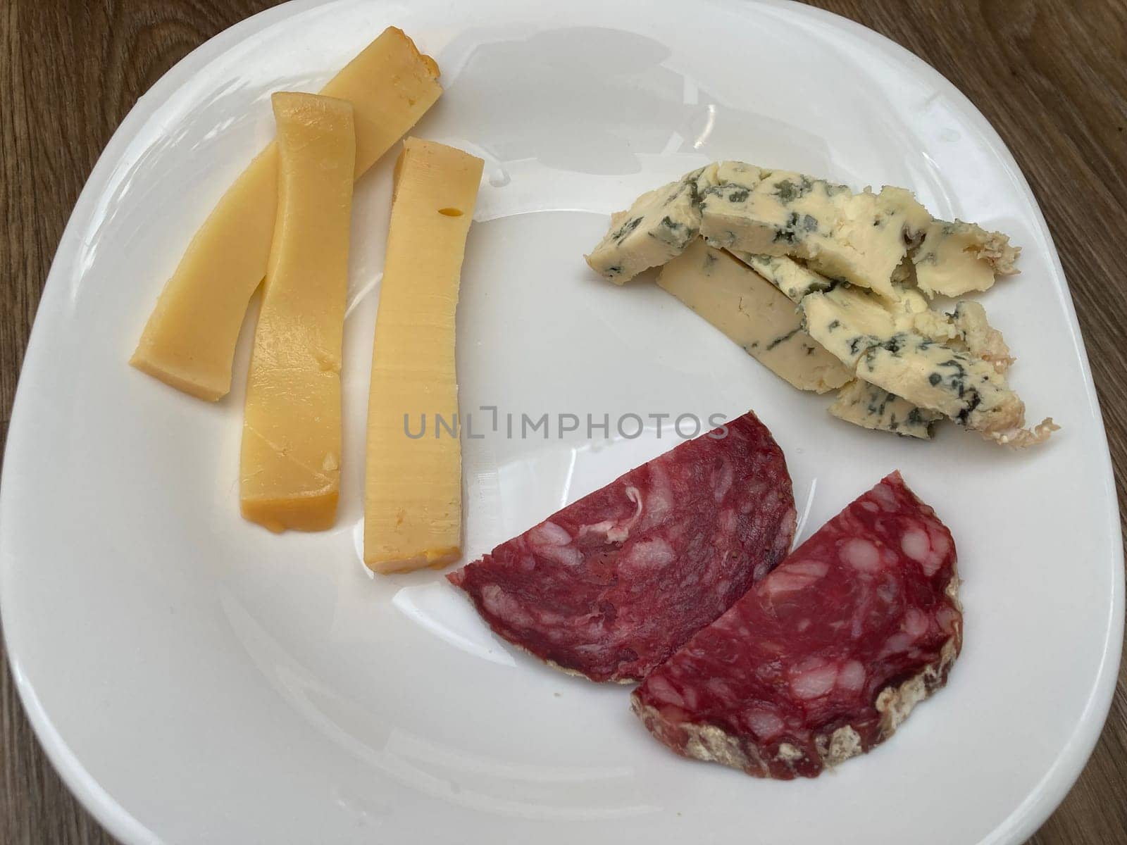 Sliced ​​meat and cheese in a the plate
