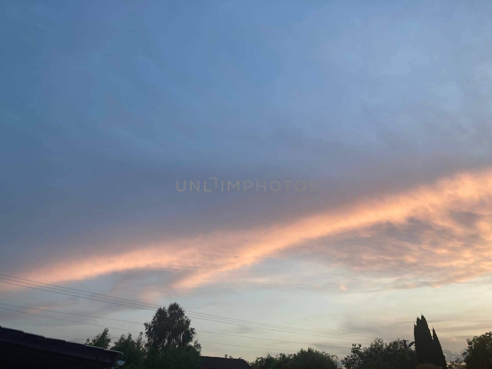 Clouds at sunset on a the hot summer day