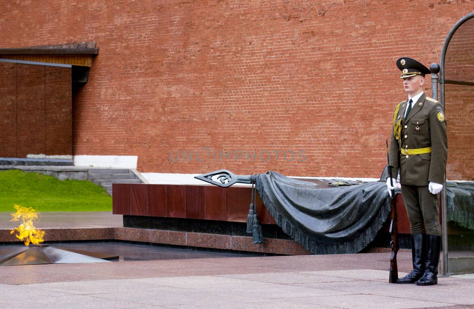 The Grave of the Unknown Soldier and the eternal flame at the Kremlin in Moscow, Russian Federation. The monument is constantly guarded by sentries.
