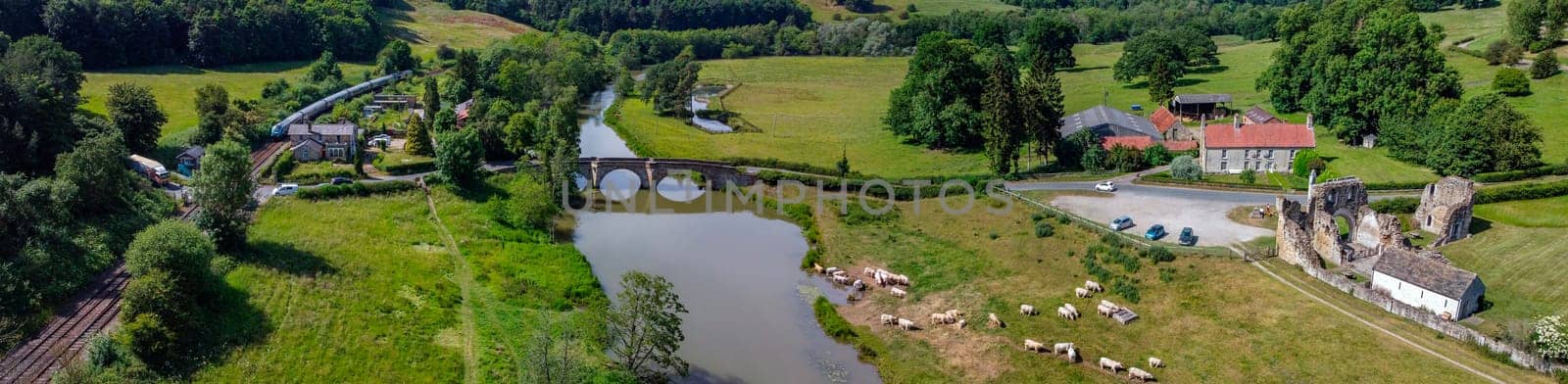 Panoramic aerial view of the village of Kirkham and the ruins of Kirkham Priory in the Ryedale District of North Yorkshire in northeast England. The ruins of Kirkham Priory are situated on the banks of the River Derwent and dates from 1120AD.