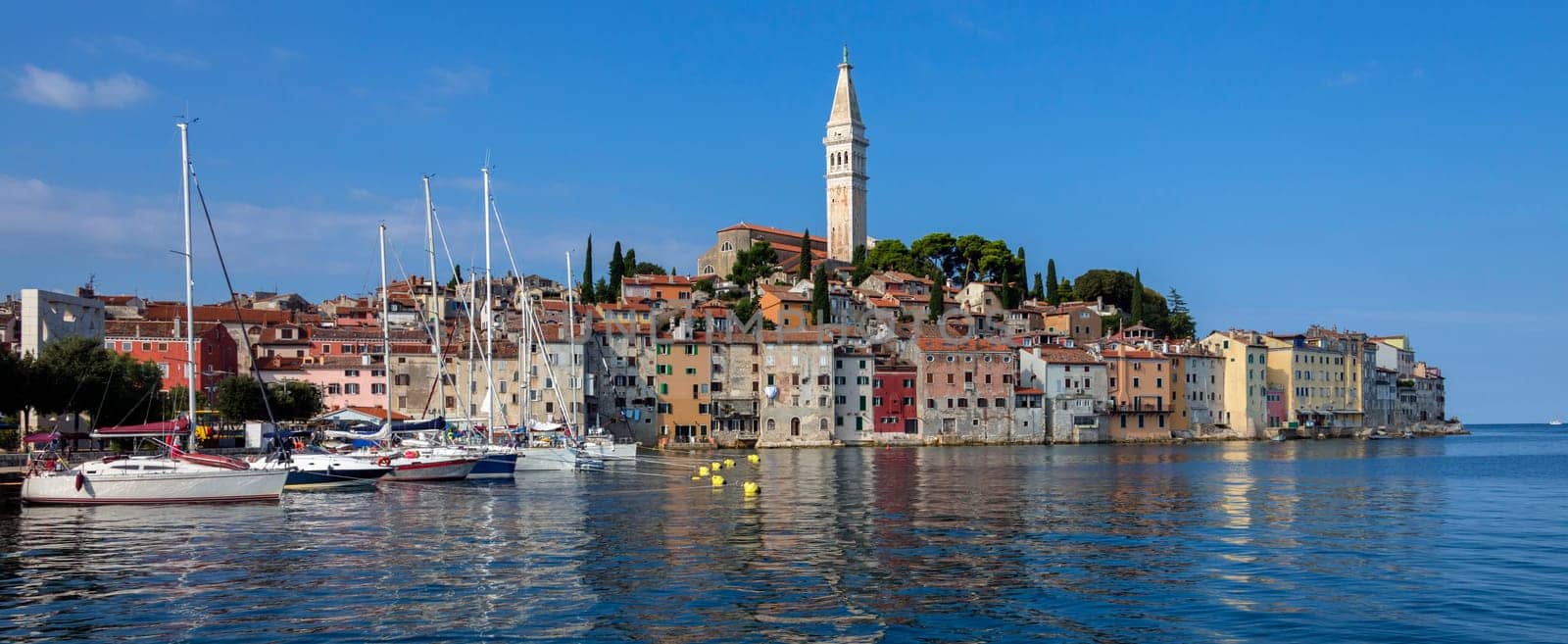 Panoramic view of the city of Rovinj in Croatia. The town is also know by its Italian name of Rovigno. Located on the western coast of the Istrian peninsula, it is a popular tourist resort and an active fishing port.