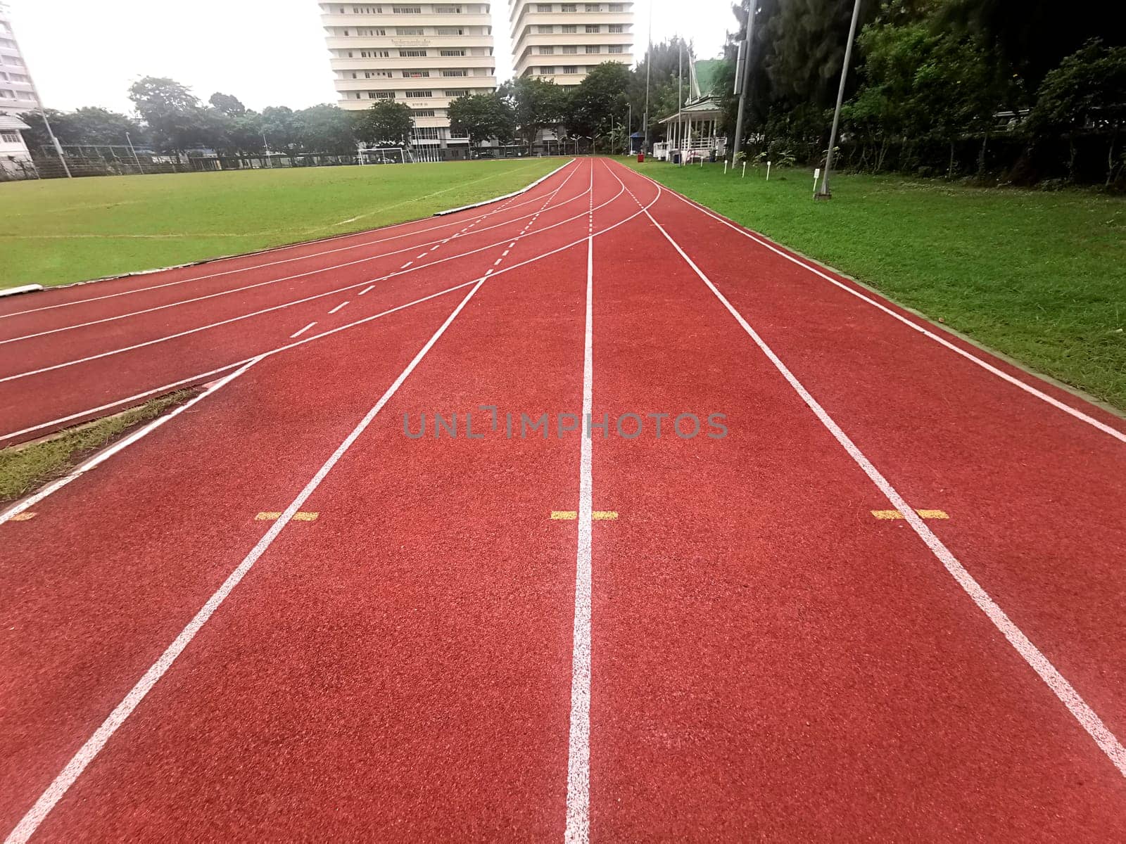 The running track inside a football stadium is usually a circular pathway surrounding the field