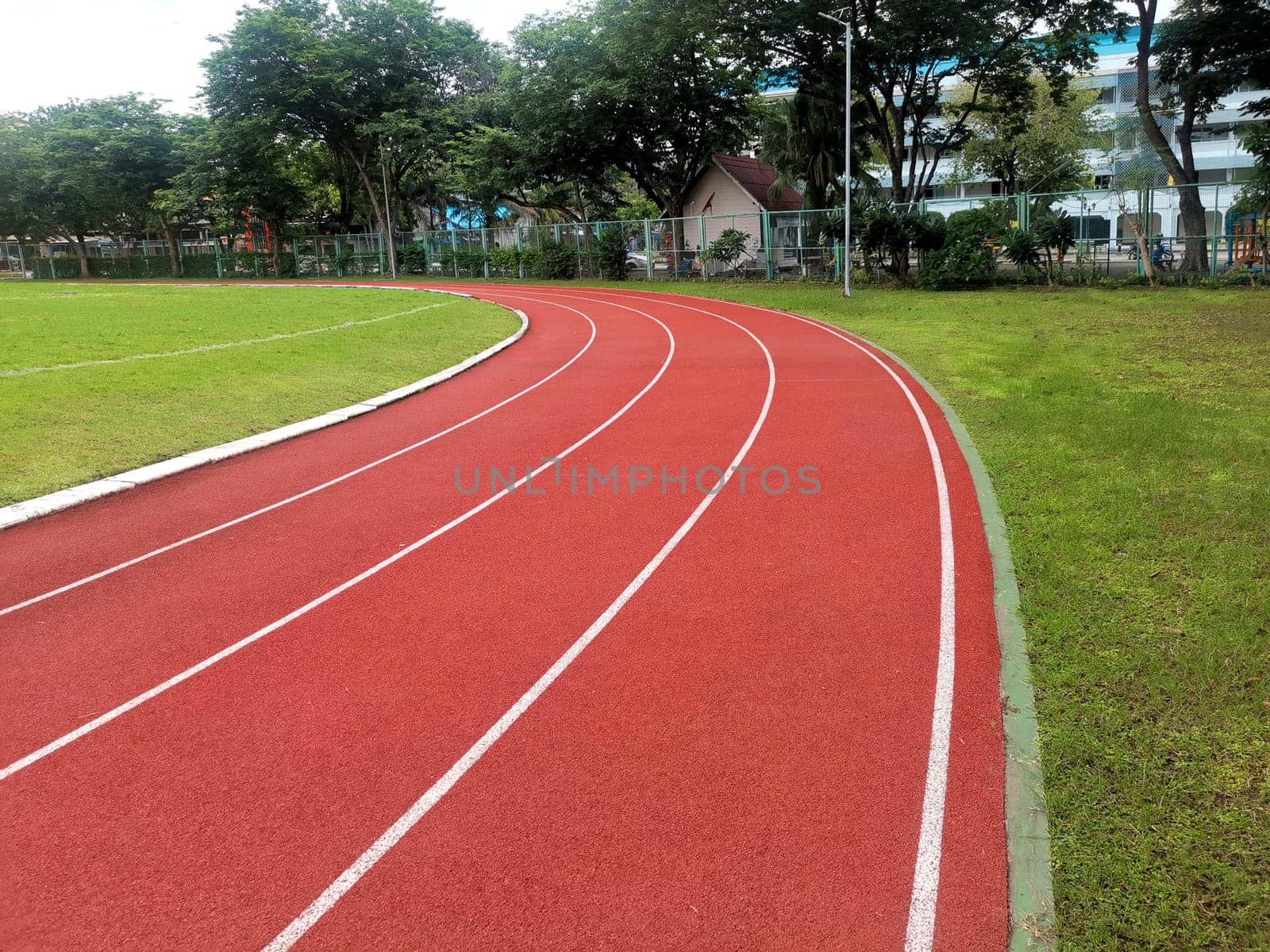 The running track inside a football stadium is usually a circular pathway surrounding the field