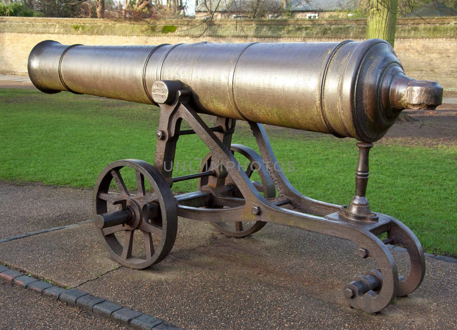 The canon on Palace Green in Ely in Cambridgeshire in southeast England. The canon was originally captured from the Russians in Sebastopol. It was given to Ely by Queen Victoria in 1860 and has stood on Palace Green ever since.