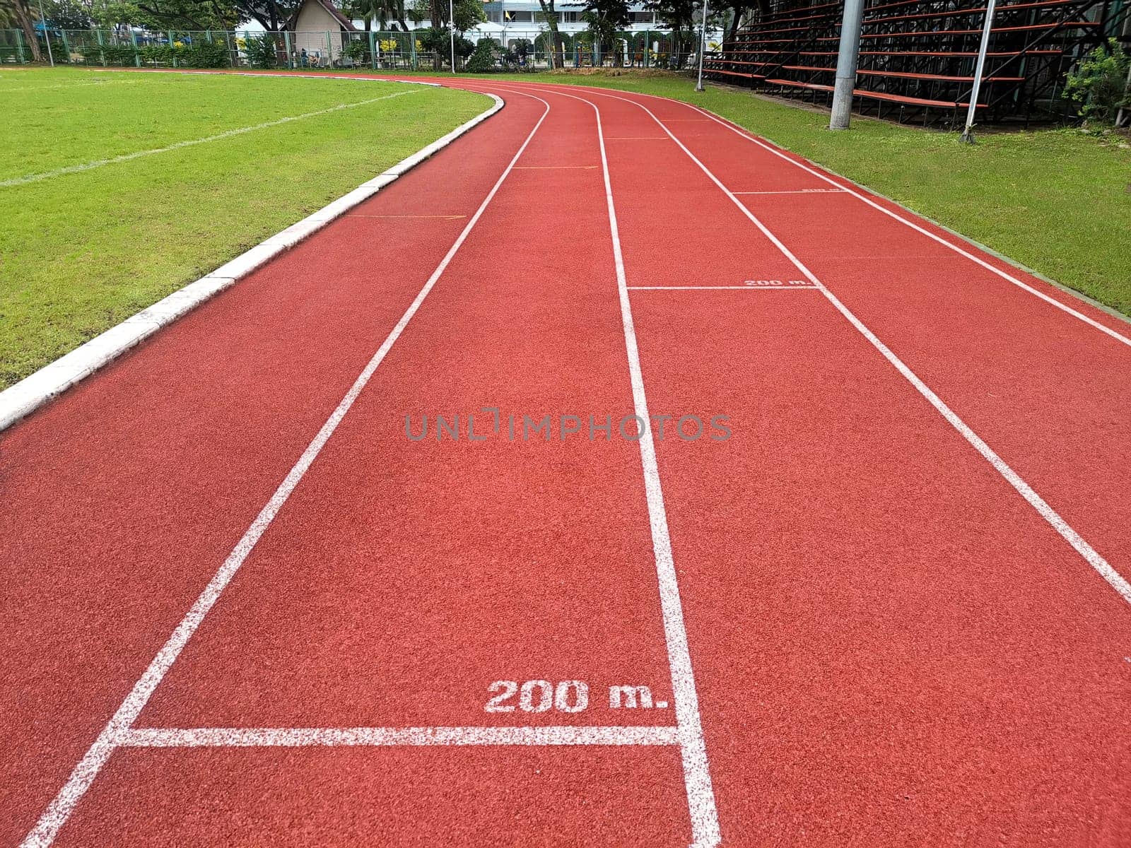 The running track inside a football stadium is usually a circular pathway surrounding the field