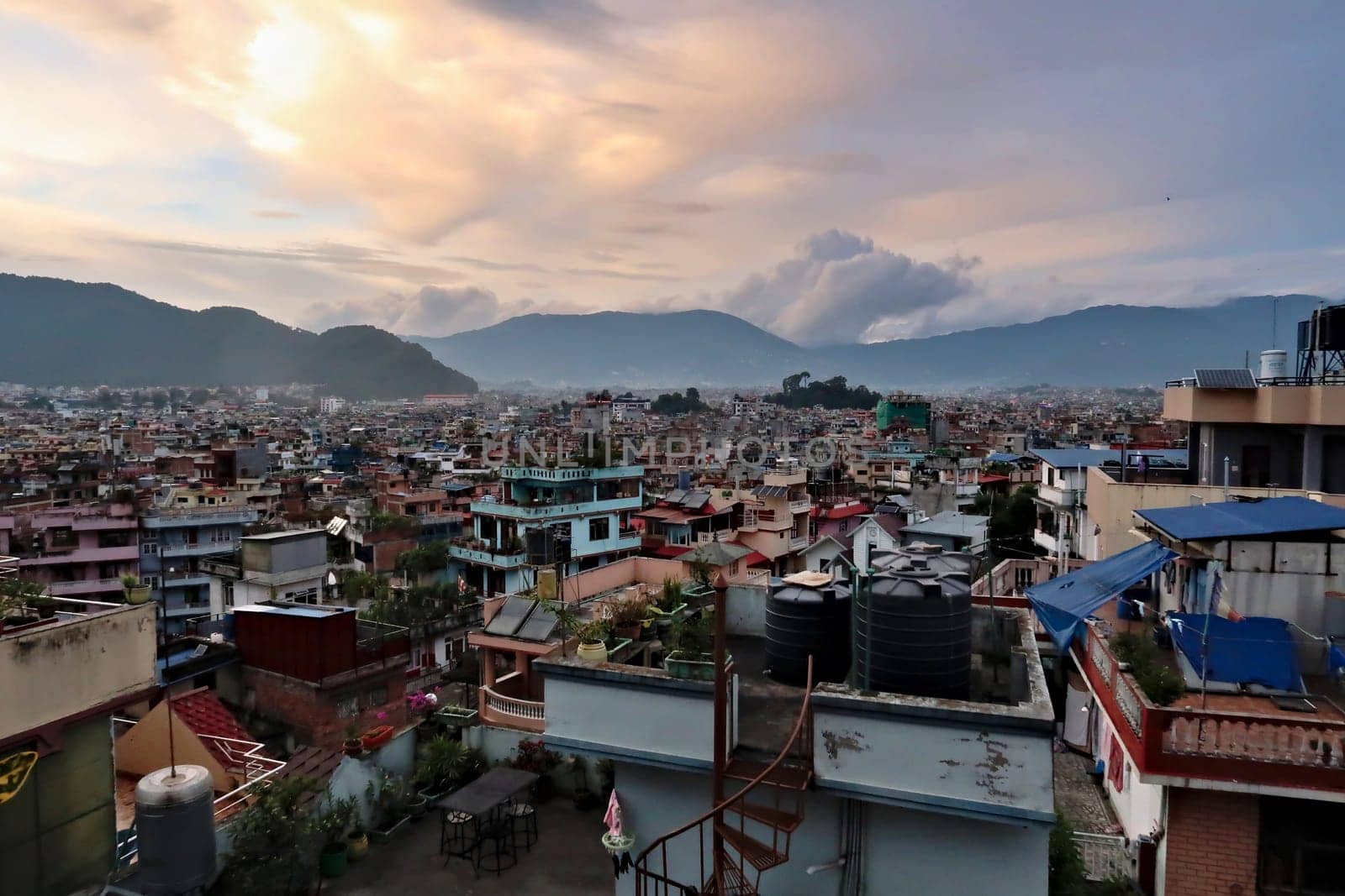 View over the colorful houses of Kathmandu from a rooftop on a cloudy evening, Kathmandu, Nepal 2022