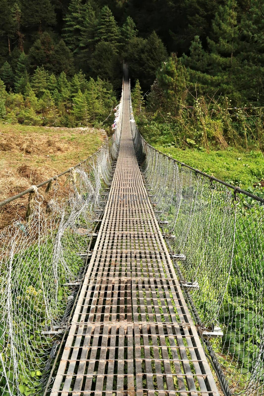 The Benkar-Manjo bridge, a long metal suspension bridge connecting the villages of Benkar and Monjo, Manjo, Mount Everest Basecamp Trek, EBC, Nepal 2022