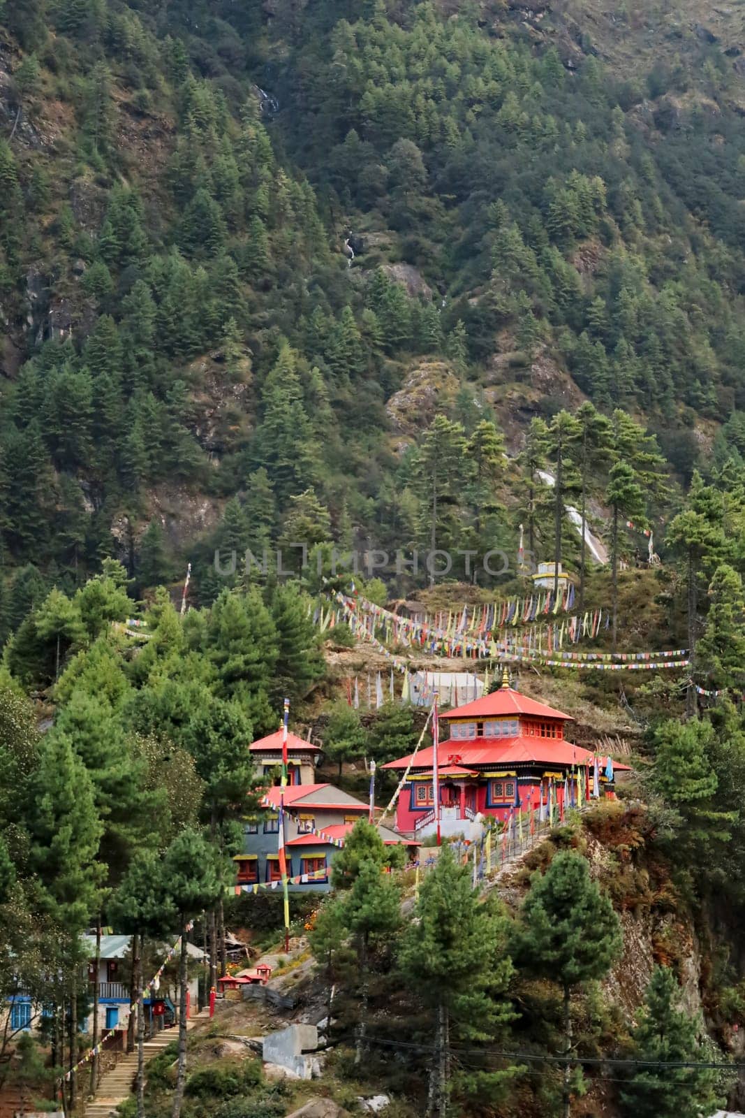 View onto the red monastery built on a hill in the Monjo, Manjo village on the Mount Everest Basecamp Trek, EBC, Nepal 2022