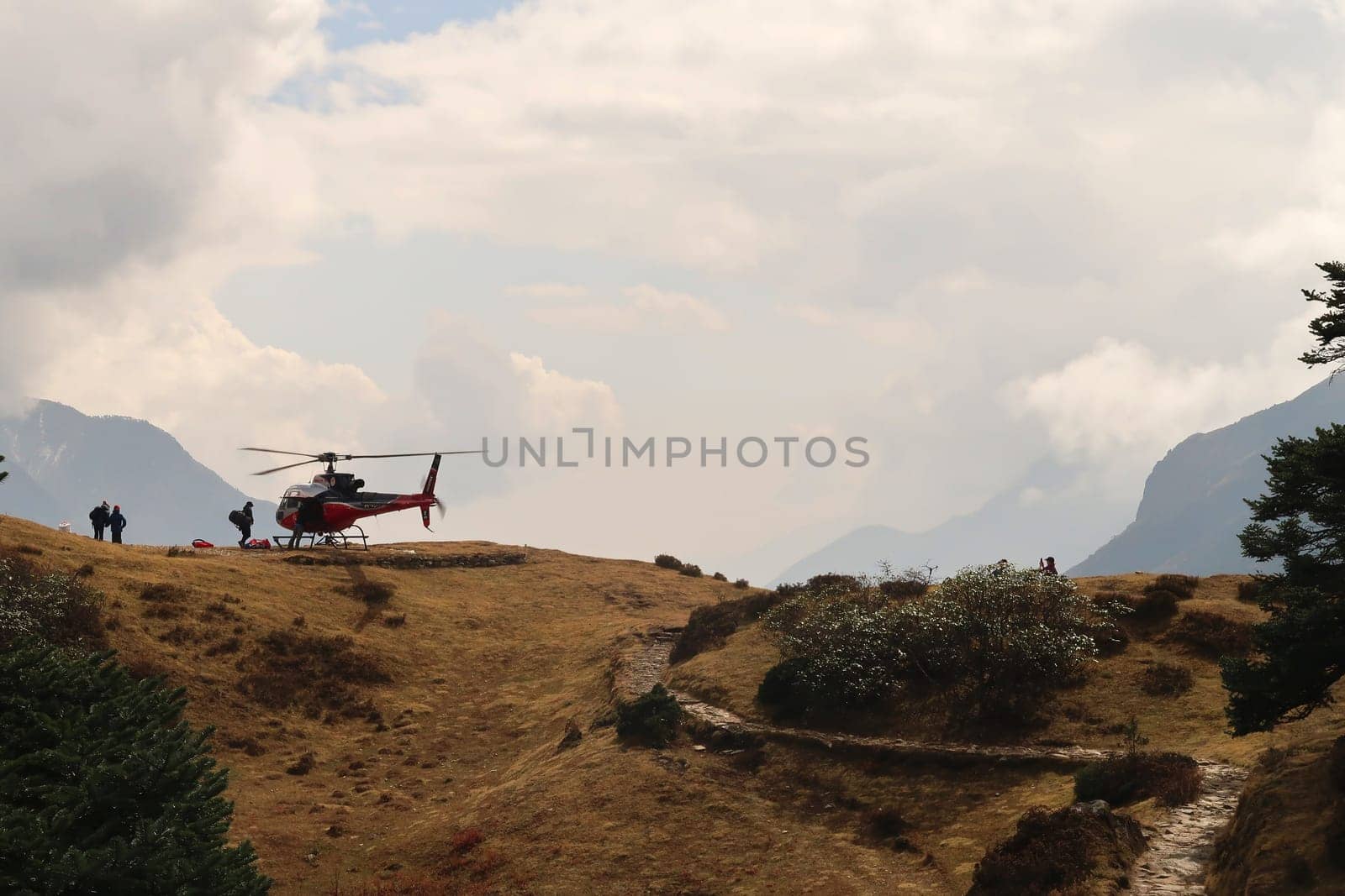 A helicopter is about to take off from the heliport close to the Mount Everest view point above Namche Bazar, Bazaar, close to Khumjung village, Mount Everest Basecamp Trek, EBC, Nepal 2022