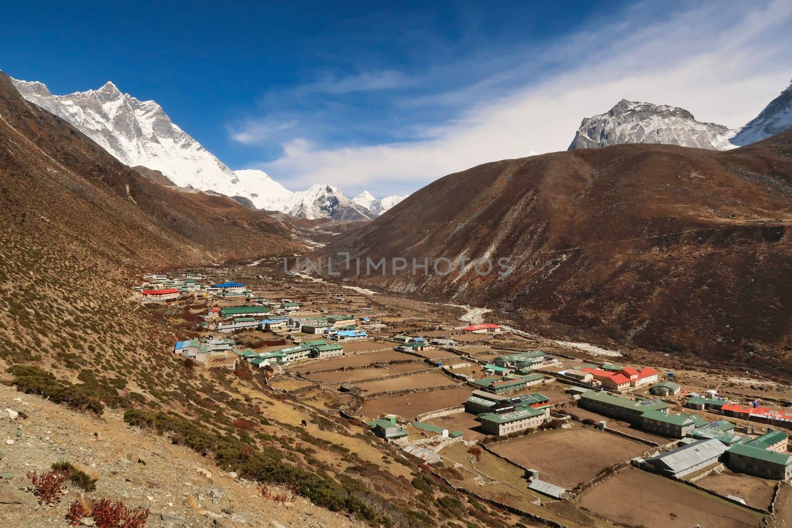 View onto Dingboche village, Mount Lhotse and Island peak can be seen in the background at the end of the valley, Mount Everest Base Camp Trek, EBC, Nepal 2022