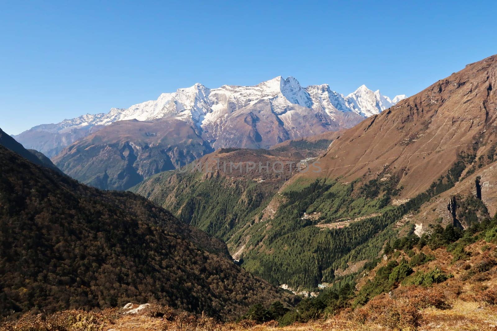 View from Tengboche, Tangboche village in the direction of Namche Bazaar, Bazar, Tashinga and Khumjung village in front of Kungde Ri peak, Mount Kongde Ri, Mount Everest Base Camp Trek, EBC, Nepal 2022