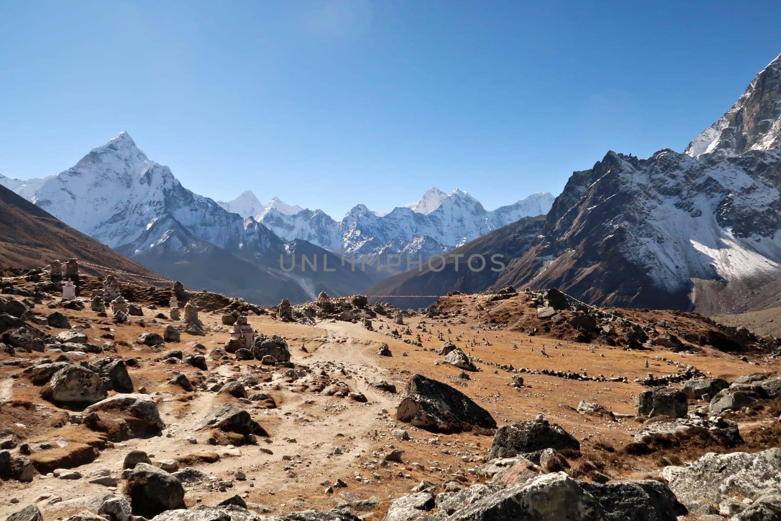 View onto the Everest Memorial Chukpi Lhara in front of Mount Amphu Gyabjen, Ama Dablam, Kangtega and Thamserku, Mount Everest Base Camp Trek, EBC, Nepal 2022