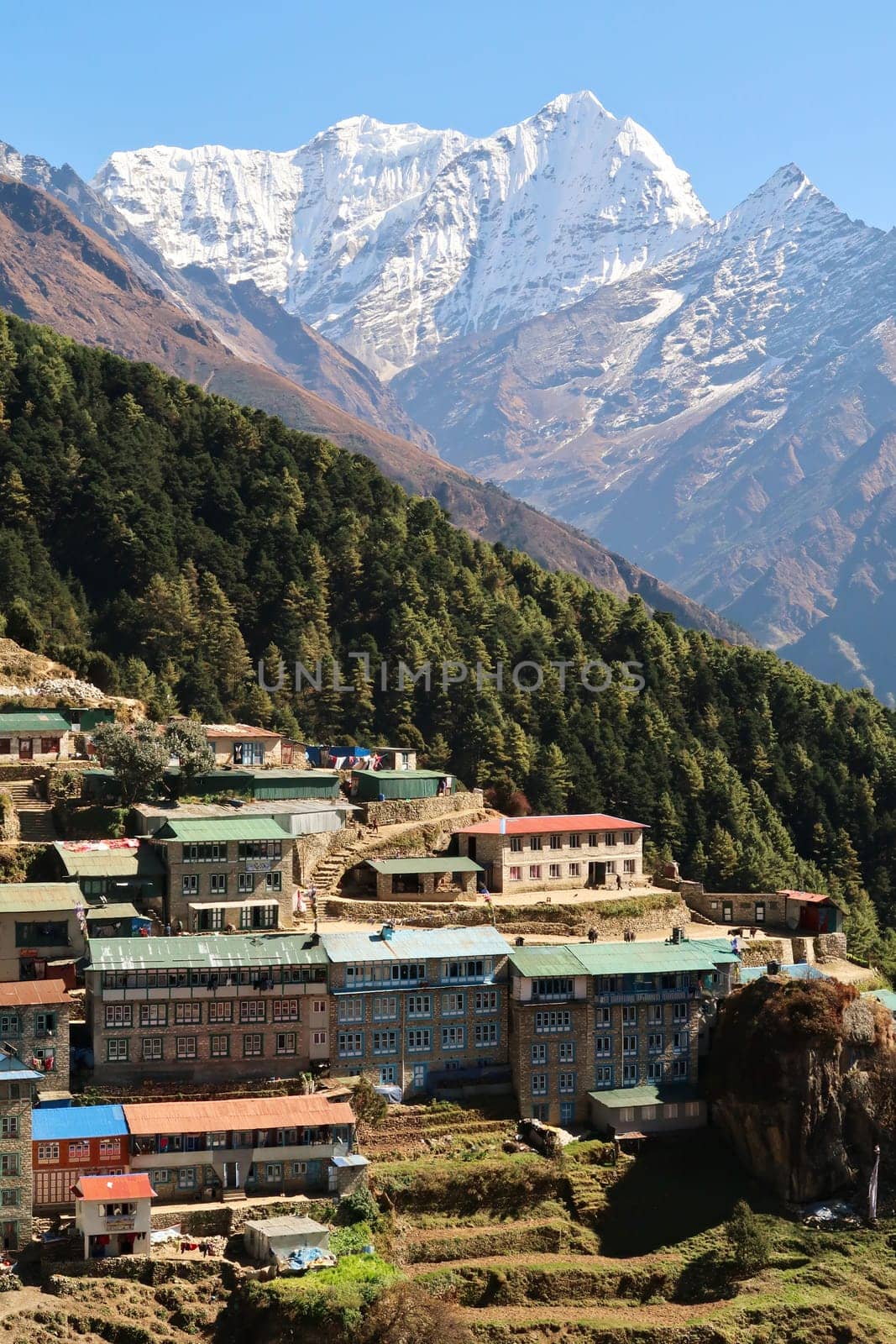 View onto a neighborhood of Namche Bazaar, Bazar with Mount Kusum Kanguru, Kangguru rising in the background, Mount Everest Base Camp Trek, EBC, Nepal 2022