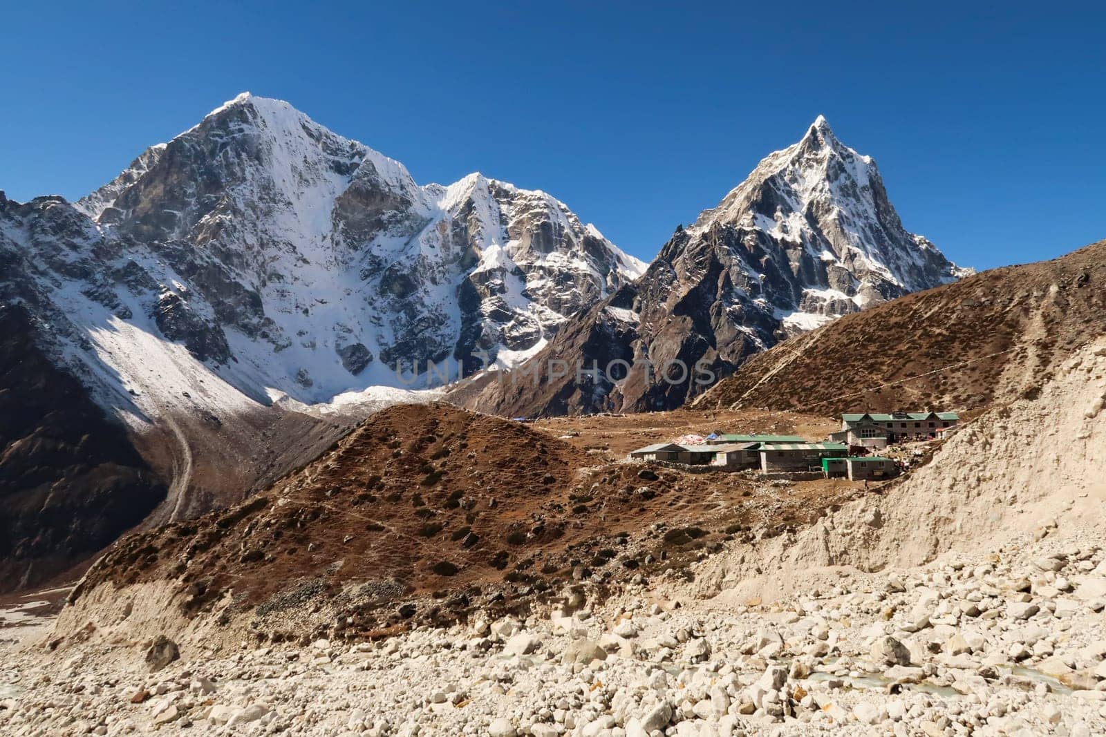 View onto the village of Dughla, Thukla in front of Mount Tobuche, Taboche and Cholatse, Mount Everest Base Camp Trek, EBC, Nepal 2022