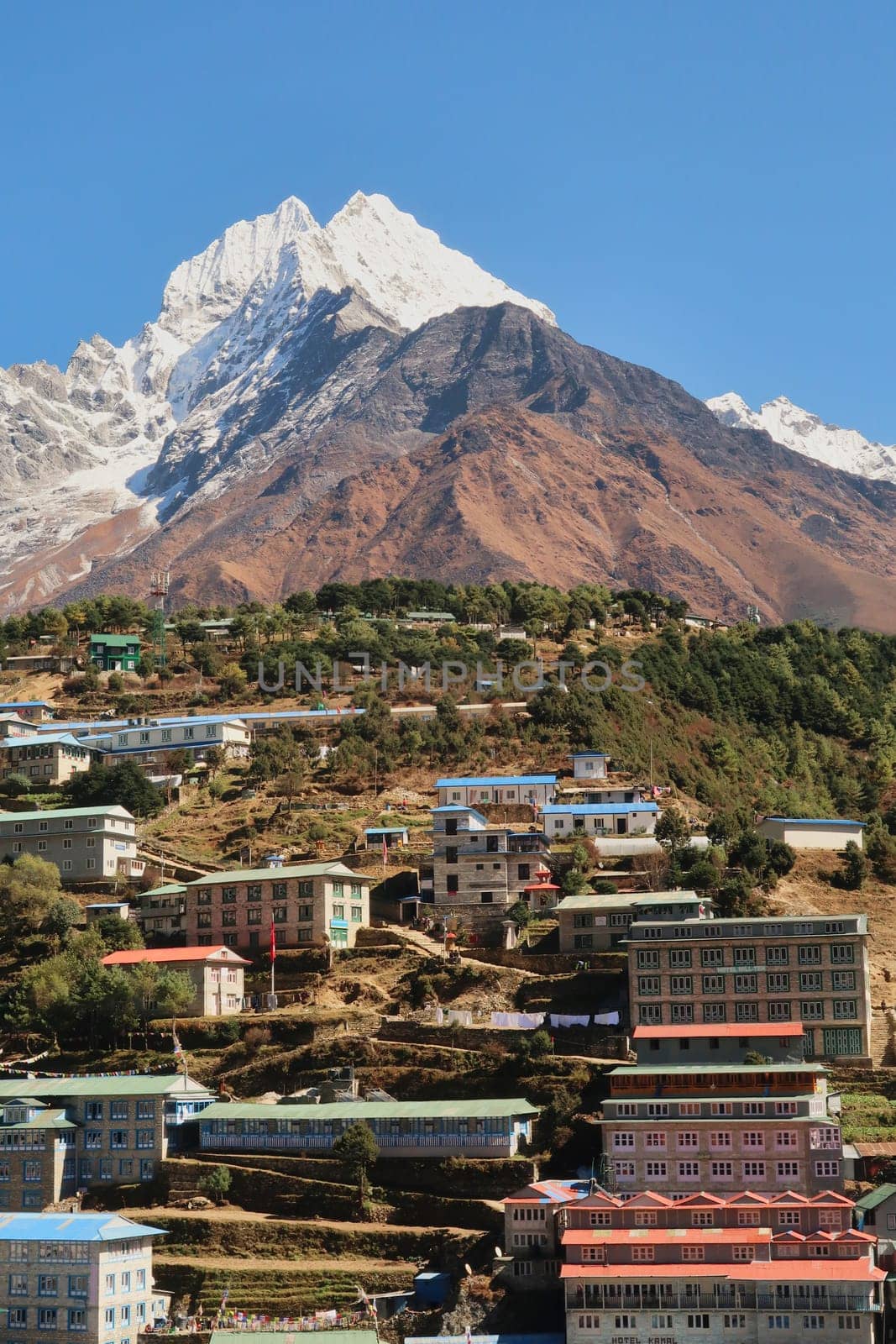 View onto a neighborhood of Namche Bazaar, Bazar with Mount Thamserku rising in the background, Mount Everest Base Camp Trek, EBC, Nepal 2022
