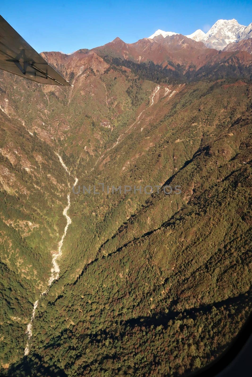 View out of the window on the flight from Lukla back to Kathmandu, spectacular mountain landscape, Mount Everest Base Camp Trek, EBC, Nepal 2022