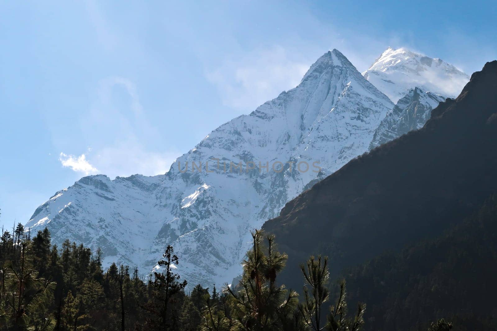 On the trail between Dhukur, Dhikur Pokhari and Upper Pisang looking back to two of the lower peaks of Mount Annapurna II, Annapurna Circuit Trek, Nepal 2022