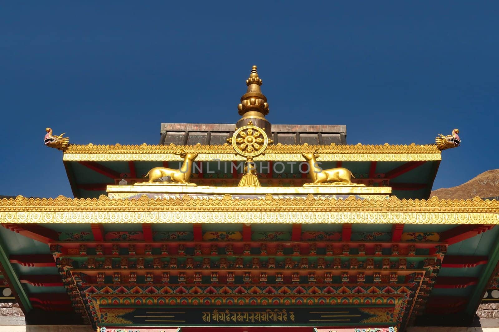 The colorful roof over the entrance to the tibetan buddhist temple of Upper Pisang, Annapurna Circuit Trek, Nepal 2022