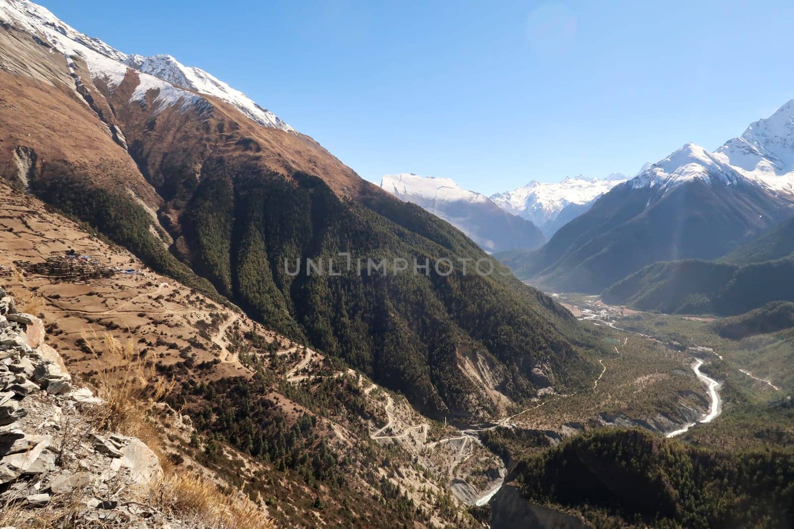 View onto the steep trail from the valley of the Marsyangdi River, Upper, Lower Pisang to the traditional mountain village of Ghyaru, Annapurna Circuit Trek, Nepal 2022