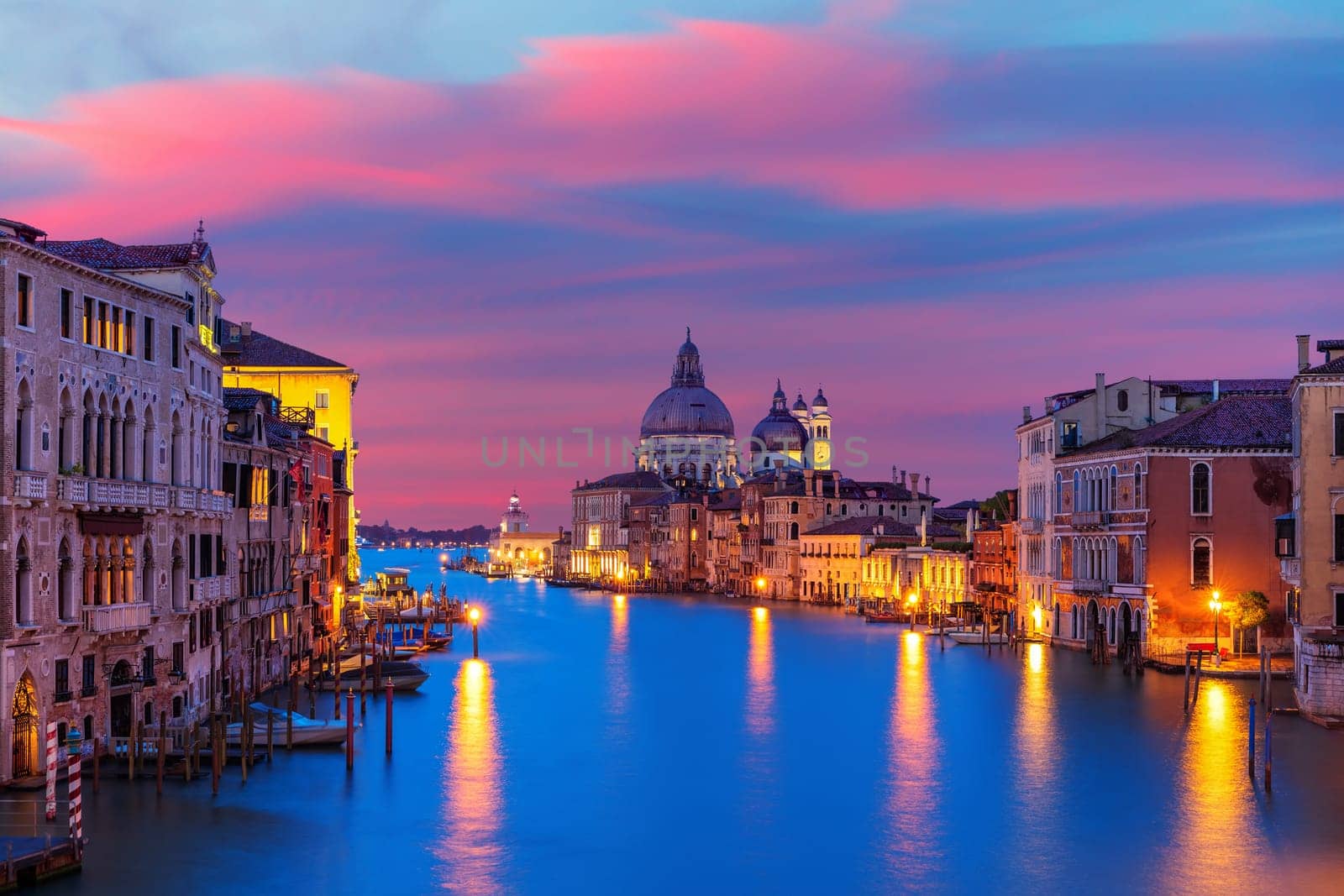 View of the Santa Maria della Salute dome in the Grand Canal at the evening, Venice, Italy.