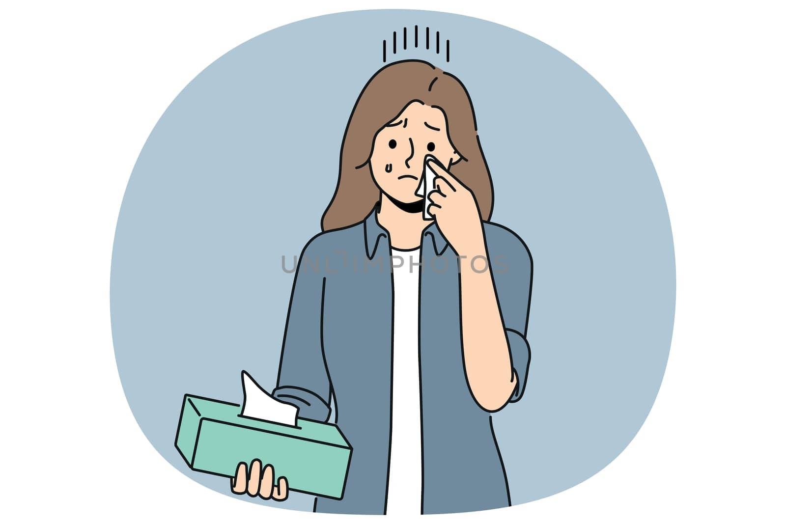 Crying woman wipes tears with paper napkins, experiencing stress and psychological suffering after breaking up with boyfriend. Crying girl holding box of disposable towels needing help of psychologist