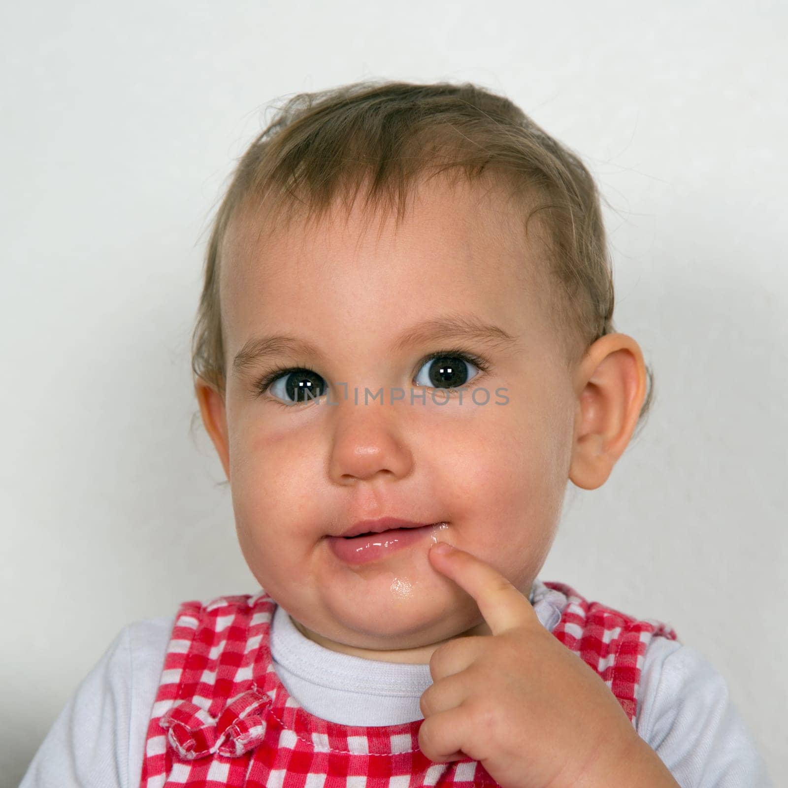 Portrait of a curious baby looking into camera