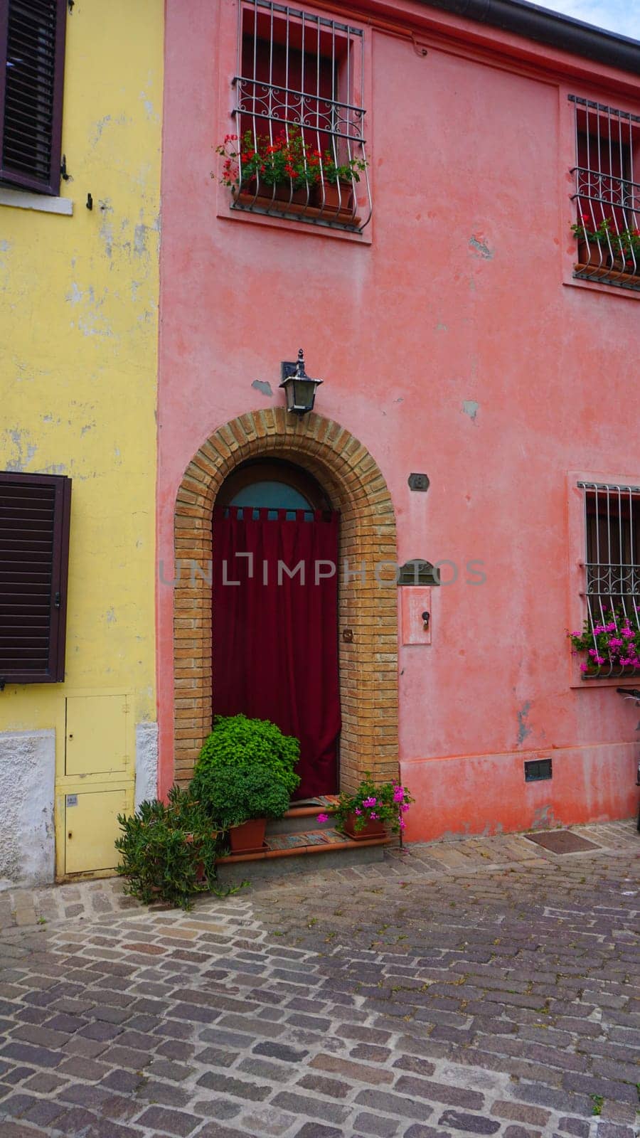 The wall at Borgo San Giuliano typical street with low and colorful houses at Rimini, Italy