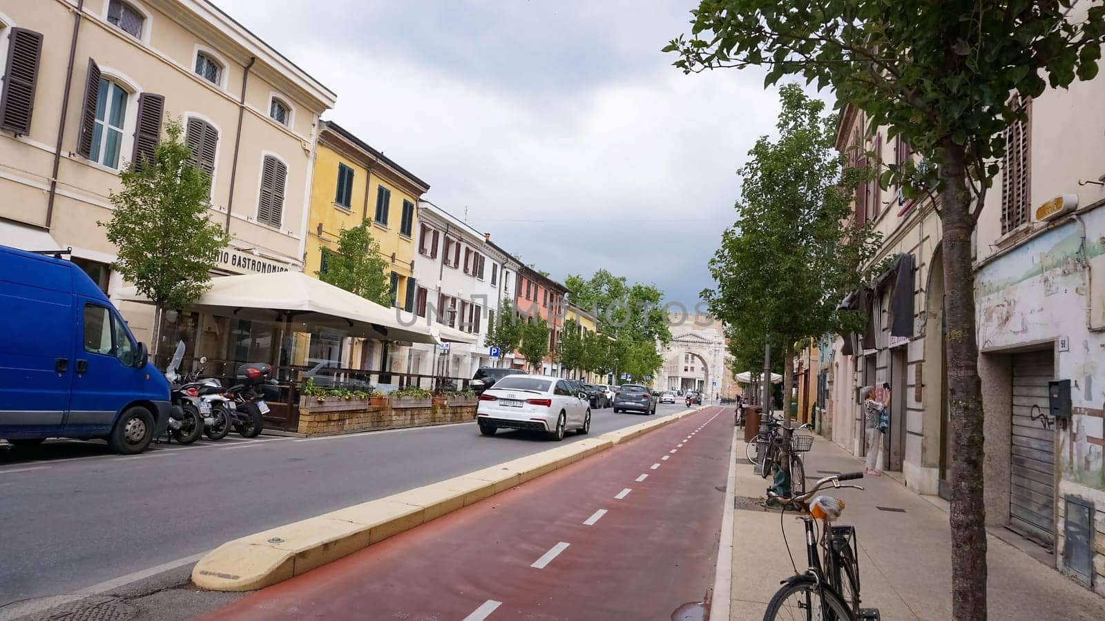 Rimini, Italy - June 25, 2024: People are passing Arch of Augustus, triumphal ancient architecture of Roman Empire, 27 BC at Italy