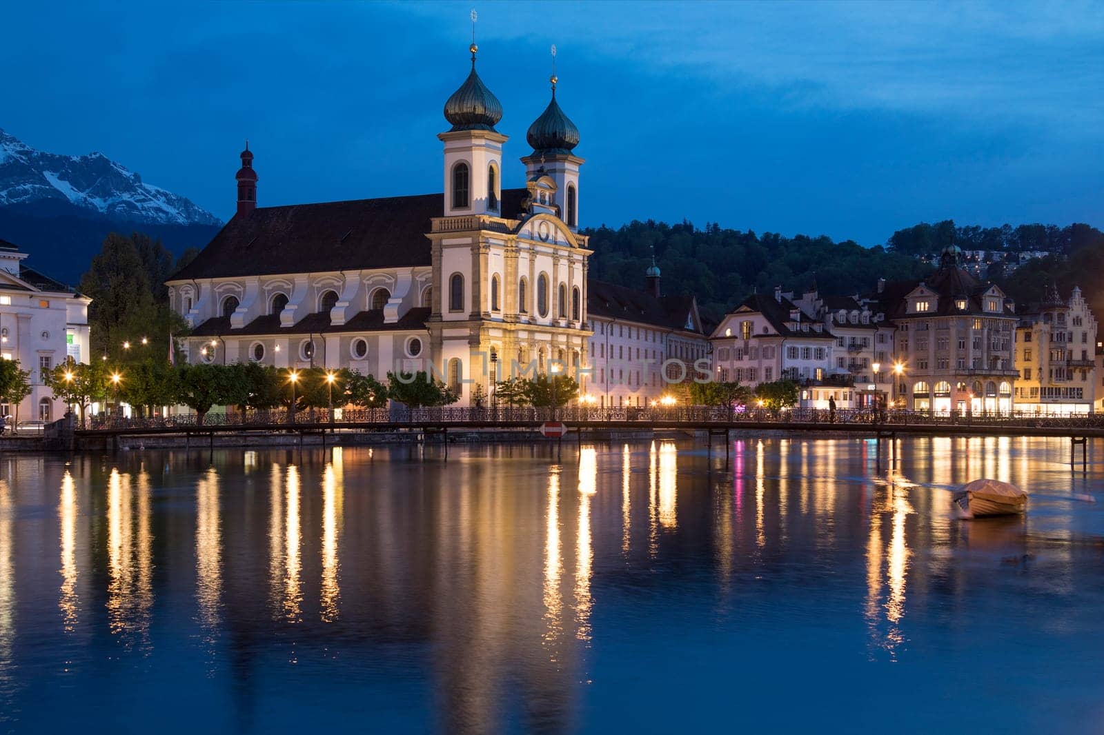 Dusk at the Jesuit Church by the River Reuss in the city of Lucerne (Luzern) in Switzerland. This Baroque church dates from 1666.