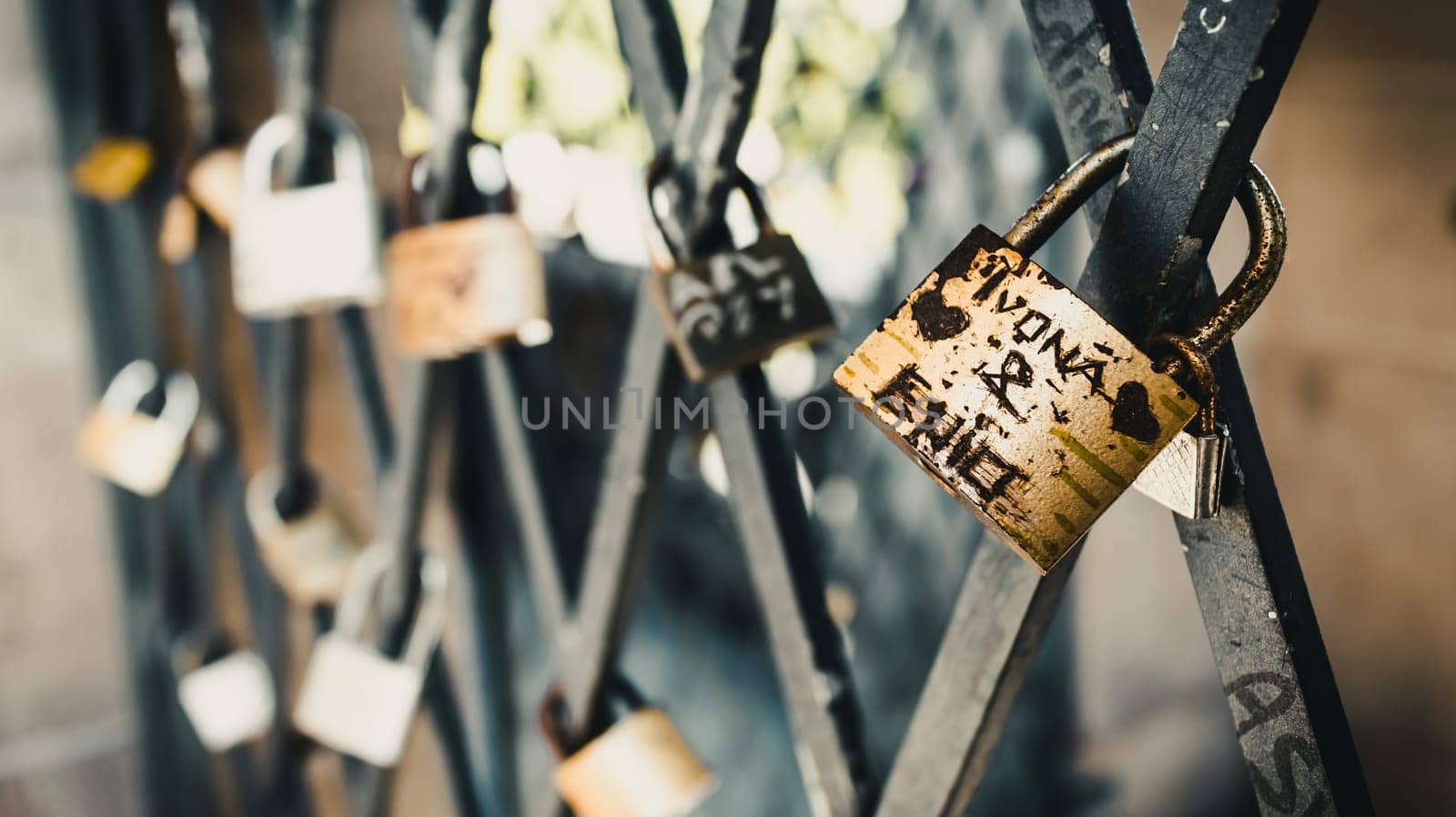 Vintage locks in soft focus as a symbol of love for friends and lovers. Padlocks are attached to old tower , Germany
