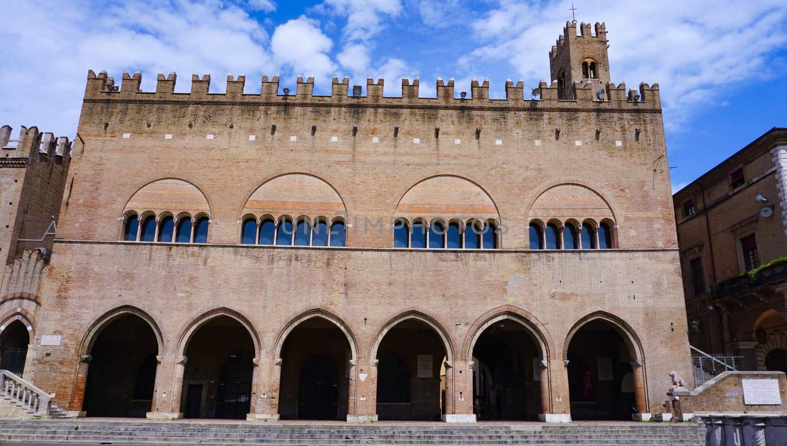 Rimini, Italy - June 25, 2024: Majestic Palazzo dell'Arengo in Piazza Cavour. Built in the XIII century in Romanesque-Gothic style at the behest of the mayor of Rimini it housed the Council of the Rimini