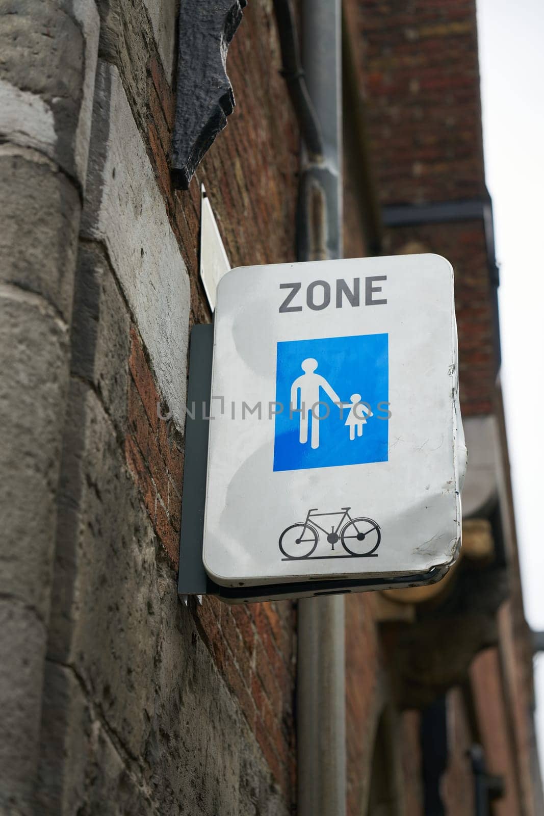 Pedestrian zone with permission to cycle in the old town of Bruges in Belgium