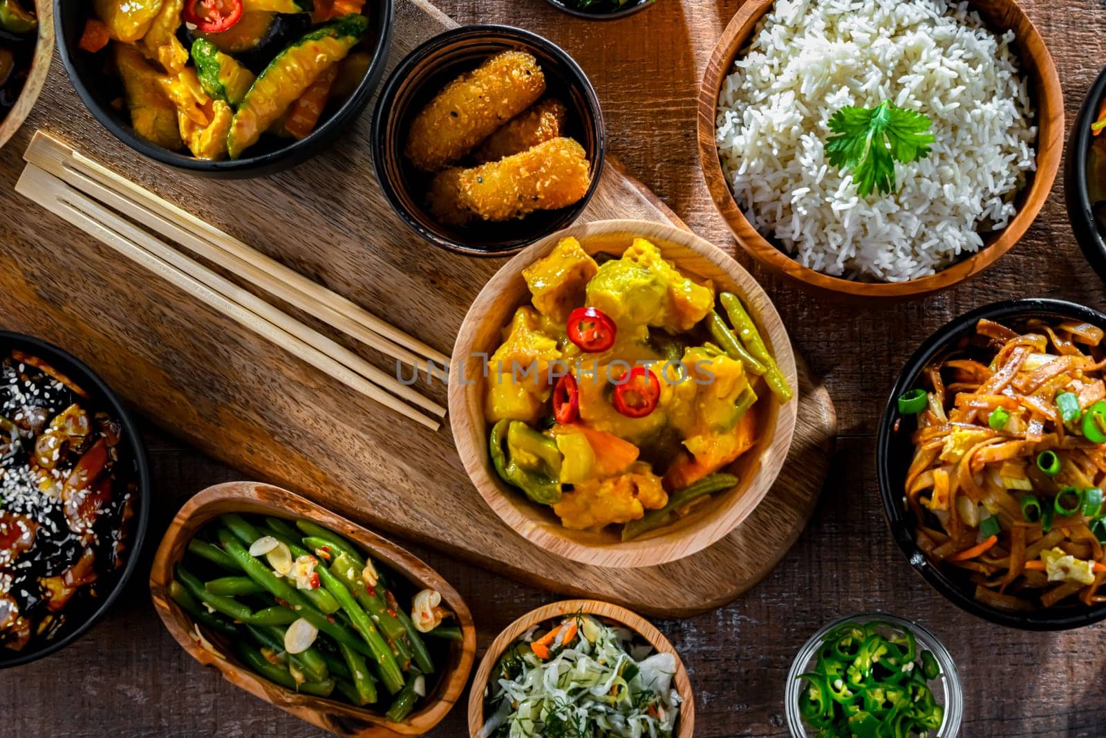 Composition with variety of east asian dishes.